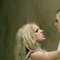 Animated sequence of two women with blonde hair interacting in a series of poses including embracing, turning heads, and close proximity.