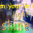 Pixelated image with yellow and orange text reading 'in your light light shine' over a blurred background of blue, green, and white tones.
