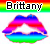 Pixelated lips with rainbow gradient fill beneath a rainbow striped banner displaying the text 'Brittany' in blocky black letters.