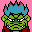 Pixel art contact sheet showing two frames of a green-skinned cartoon character with blue hair and red clothing against contrasting backgrounds.