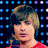 Four distinct pixelated images of a young man with light brown hair arranged in a , each showing different expressions and backgrounds