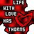 Red and white pixelated text with heart symbols repeating 'LIFE WITH LOVE HAS THORNS BUT LIFE WITHOUT LOVE HAS NO ROSE' in a pattern
