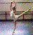 Pixelated static image of a figure in ballet pose with arms extended, wearing white and black attire against multicolored background.