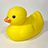Yellow rubber duck with orange beak and blue eye on light gray background, next to pink text reading 'ducky' and 'quack!' on bright yellow field.