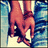 Pixelated image of two hands clasped together with a blue and white striped background, transitioning to include pink text and a heart symbol.