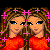 Animated pixel art of two identical female figures with brown hair, blue eyes, and orange tops, standing side-by-side with pink star accents around their heads.