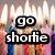 Animated birthday-themed icon with candles and text overlays, featuring flame animations and changing text phrases.