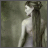 Static pixelated image of a woman with long dark hair in profile, wearing light-colored clothing against a muted greenish background.