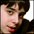 Pixelated image of a person with dark hair and light skin on the left, next to green text reading 'Original Icons .com' on a solid green background.