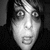 Black-and-white pixelated portrait of a person with dark hair and wide eyes, paired with red text reading "Matt" and "Good" alongside heart symbols on black background.