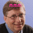 A pixelated image of a person with short brown hair wearing a dark jacket over a light blue shirt, with pink text above the head on a light blue background.