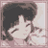 Pixelated static icon of a character with dark hair and light skin in profile view, framed by a pink border on a gray background.
