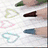 A collage of text-based designs with heart symbols and color-coded phrases on a white background.