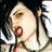 Pixelated close-up of a person with dark hair, light skin, and red lips holding a microphone with a red ring, wearing a white top against a dark background.
