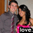 Two people stand close together; the person on the right wears a pink top with 'love' text, while the left person wears gray clothing.