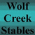 Static image with teal background displaying text: 'Wolf Creek Stables' on left, 'Were howling is pretty normal' on right.