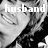 Black-and-white pixelated image with the word 'husband' overlaid in large white letters, featuring a partial figure with visible hair and clothing details.