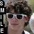 A person with brown curly hair and white sunglasses appears in two side-by-side frames, the left frame showing a slightly wider view of the background.