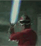 A character in red clothing and goggles holds a glowing blue lightsaber, with pixelated background and motion blur effects.