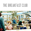 The Breakfast Club movie poster shows a cafeteria scene with multiple people seated at tables, a person standing in the foreground, and a person in the background holding a large object.