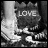 Black-and-white pixelated icon with the word "LOVE" prominently displayed over a stylized background featuring abstract shapes and light gradients.