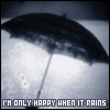 Black-and-white animation of a dark umbrella over a light background with circular patterns, text reading "I'M ONLY HAPPY WHEN IT RAINS" at the bottom.