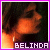 Pixelated image of a figure with orange and brown tones against dark background, bordered by purple frame with white inner edge, text 'BELINDA' at bottom.