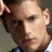 A pixelated image of a person with short hair, wearing a dark jacket over a light shirt, with cyan text overlay reading 'wentworth=loveee' on the right side.