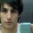A person with dark hair and a light blue sleeveless shirt appears in four showing subtle facial expression changes
