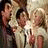 Static image with four quadrants: top-left shows a pixelated group of people, top-right and bottom-left contain blue text on white backgrounds, bottom-right is empty gray space.