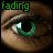 Green-eyed eye with brown skin and visible eyelashes, displaying a fading animation effect