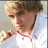 A pixelated image of a person in a white jacket with red trim, set against a bright blue background with yellow text reading "I LOVE DANIEL!!!".