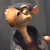 Pixelated cartoon character with large rounded head, brown fur, and wide eyes, wearing dark blue shirt against gray background.