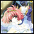 Anime-style character with pink and blue hair in a close embrace, set against a blurred background with visible text on the right.