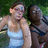 Two people sit outdoors on a bench with green foliage background; purple background with pixelated text reading 'sure we're dorks but we're your dorks and that makes us cool'.