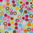 Blue text 'SARAH!!!' appears over a light blue background filled with small, colorful pixelated shapes including circles and squares in red, yellow, green, brown, orange, pink, and white.