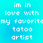 Pixelated text on a cyan background reads "im in love with my favoritemy favorite tatoos artist" across two identical