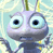 Pixelated cartoon insect with large blue eyes, purple head, and dark gray body, standing against a light blue and white background.