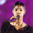 A pixelated contact sheet showing two frames of an animated icon featuring a person holding a microphone against a purple background and green text reading "Original Icons .com".