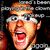Pixelated close-up of a person with light brown hair and glasses, mouth open in an exaggerated expression against dark background.