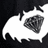 A pixelated black-and-white icon shows a white crescent shape with a dark, textured circular object inside, set against a black background.