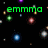 Green pixelated text 'emma' and 'rocks' on black background with scattered colored dots and blue circular shapes.