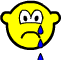 Yellow cartoon face with downturned mouth and white eyes crying blue tears against gray background.