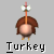 Pixelated icon of a turkey with brown feathers, a light pink body, and a red wattle, standing on two small yellow feet with the word "Turkey" below.