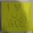 Yellow-green gradient background with faint, pixelated text reading 'I Y U L A R E' in a stylized font.