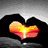Animated icon shows hands forming a heart with sunset, beach heart drawing, and couple silhouette.