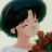 Anime character with dark green hair and closed eyes, wearing a white shirt with red and green accents, against a light background.