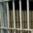 Pixelated image of prison bars with red text stating 'your best friend will bail u out of jail BUT.........' and 'your true friend will be right next to u saying... THAT WAS FREAKIN' AWESOME!'