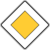A static diamond-shaped icon with a yellow center, white middle border, and dark gray outer border on a light gray background.