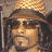 A 4-frame contact sheet of a pixelated animated icon featuring a man with long dark hair, sunglasses, and a brown hat in various poses against a black background with "Coolbuddy.com" text.
